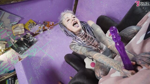 Anuskatzz gags on a purple dildo, then double-stuffs her holes