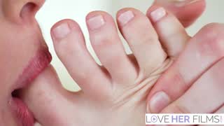 Olivia Madison licks and sucks her own bare toes on the kitchen island