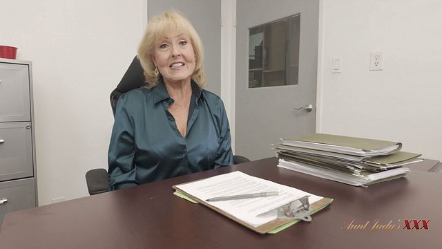 Mature secretary strips naked and fingers her pussy on the desk, Desiree